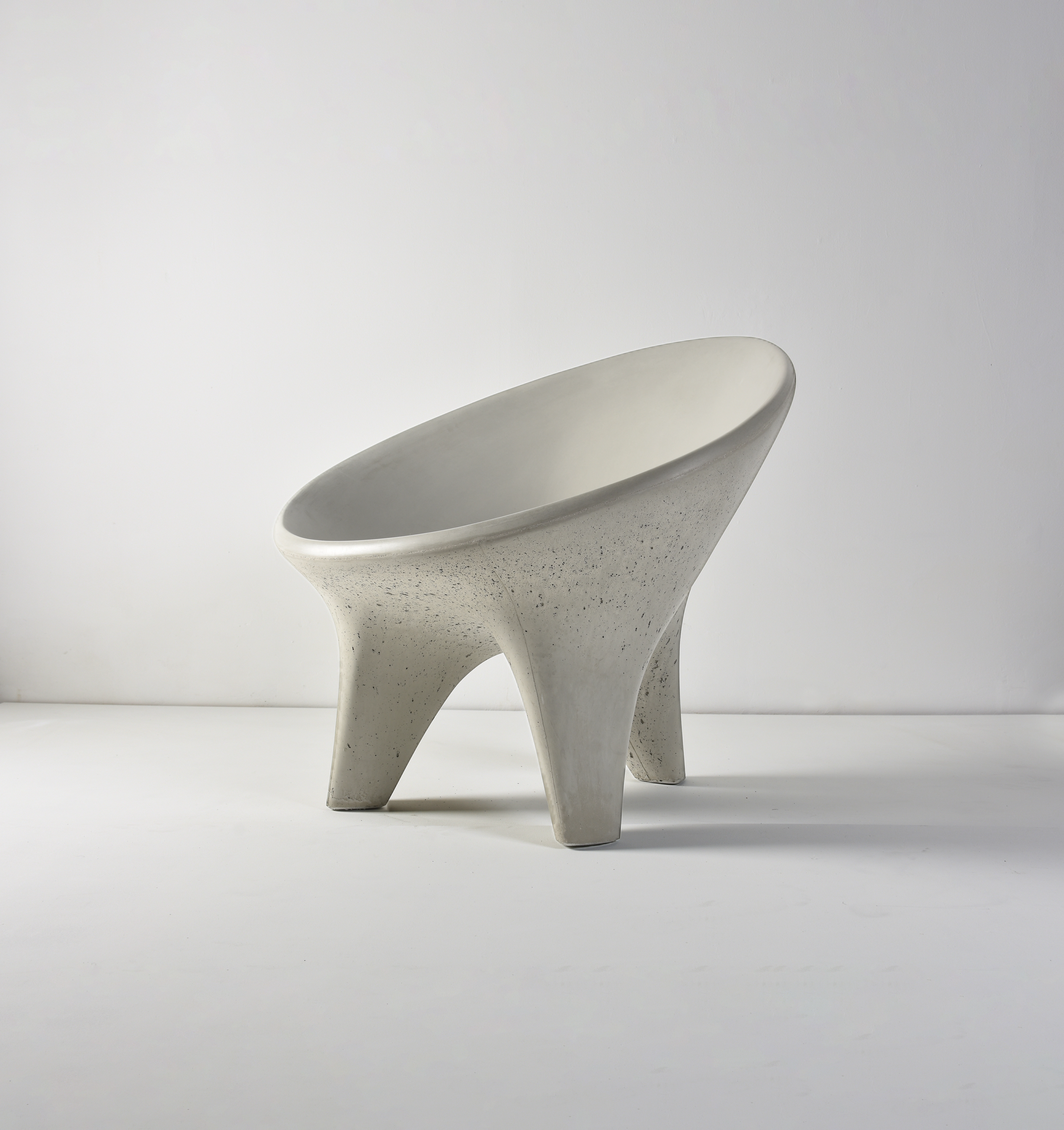Pale sculptural chair on a white background